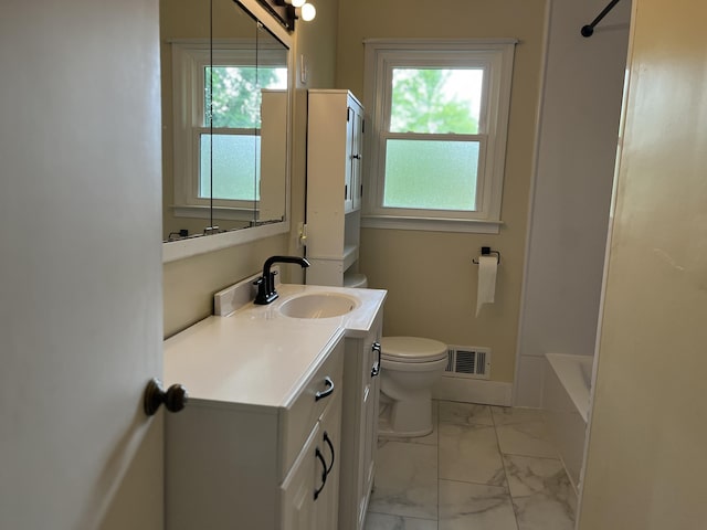 2120 Hemlock Ave, Portage, MI 49024 - full bath with toilet, marble look tile flooring, vanity, and plenty of natural light