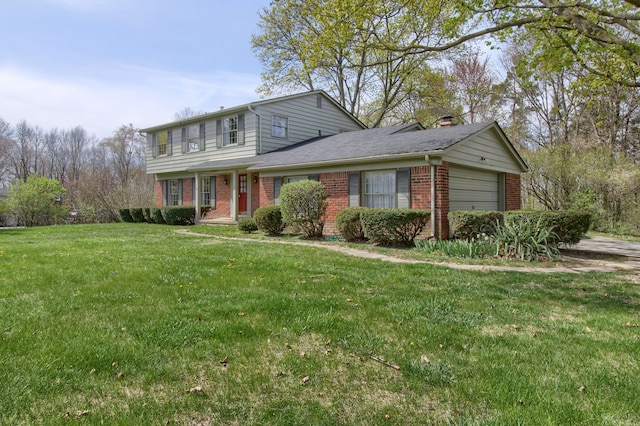 traditional-style home featuring a front lawn, a garage, and brick siding