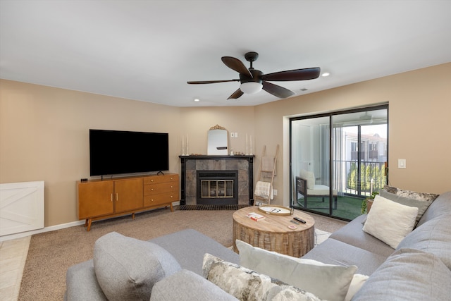 living area featuring recessed lighting, a fireplace, and a ceiling fan