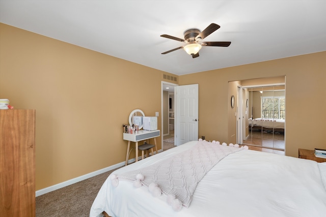 bedroom featuring visible vents, carpet floors, a closet, baseboards, and ceiling fan