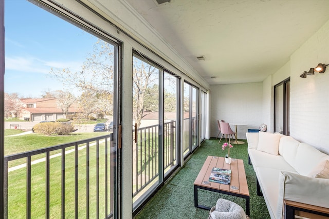 sunroom / solarium with outdoor lounge area, visible vents, and carpet