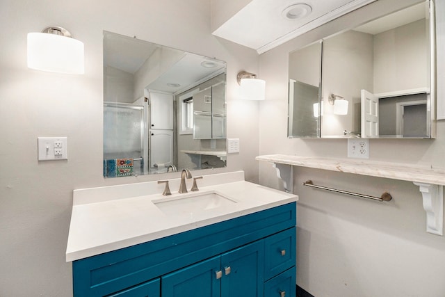 full bath with vanity and a stall shower