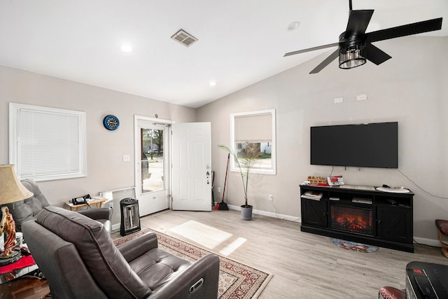 living area with ceiling fan, light wood-style floors, recessed lighting, vaulted ceiling, and visible vents