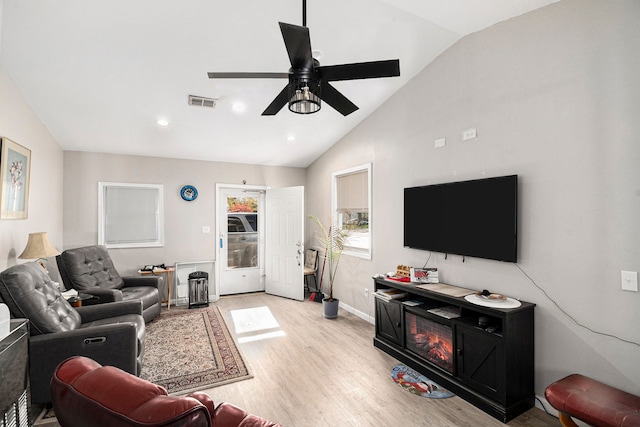 living area with ceiling fan, light wood-style floors, high vaulted ceiling, recessed lighting, and baseboards