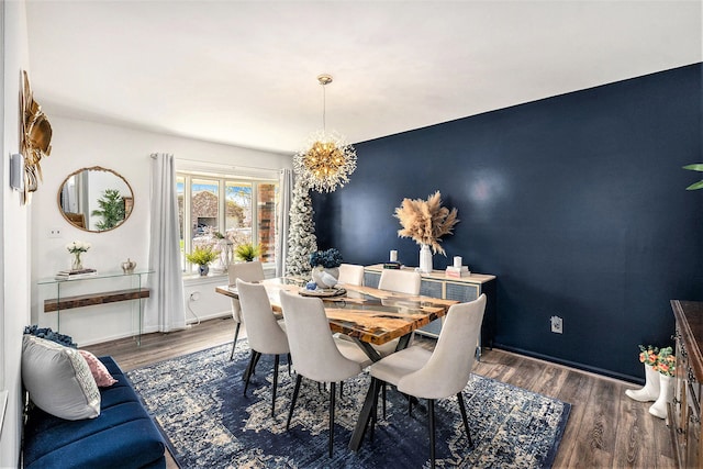 dining room featuring a chandelier and wood finished floors