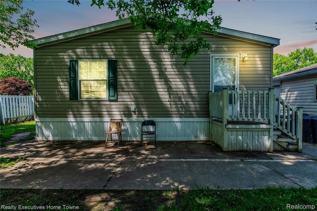 1822 Elizabeth Ter, Madison Heights, MI 48071 - back of property at dusk featuring a patio