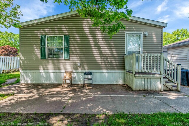 1822 Elizabeth Ter, Madison Heights, MI 48071 - rear view of house with a patio area
