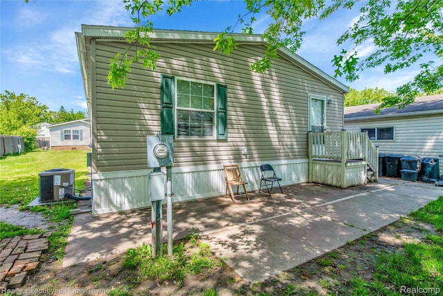 1822 Elizabeth Ter, Madison Heights, MI 48071 - back of property featuring central air condition unit, a patio area, and a yard