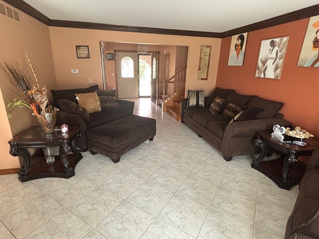 living area featuring ornamental molding, light tile patterned flooring, visible vents, and stairway