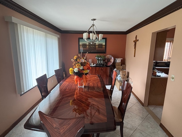 dining area featuring light tile patterned floors, a chandelier, crown molding, and baseboards