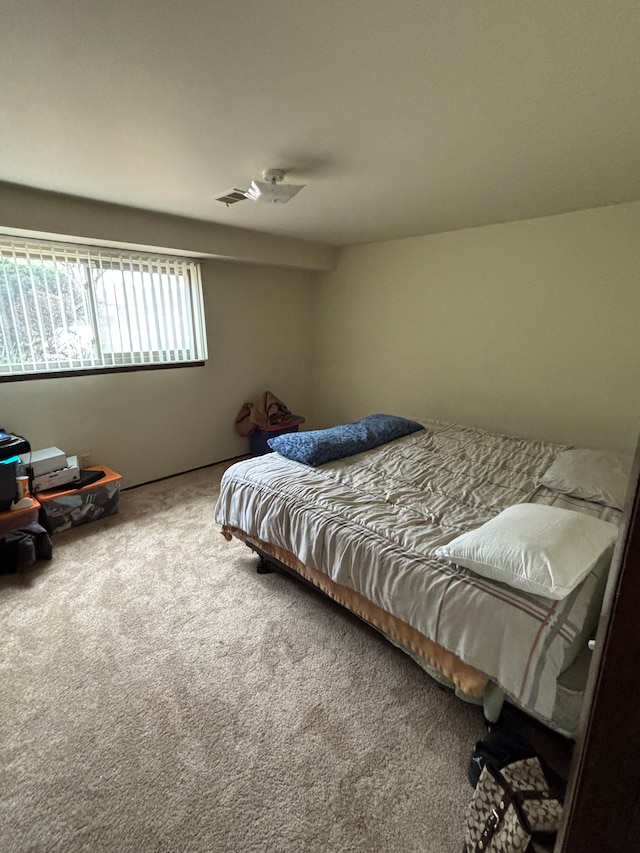 bedroom featuring visible vents and carpet floors