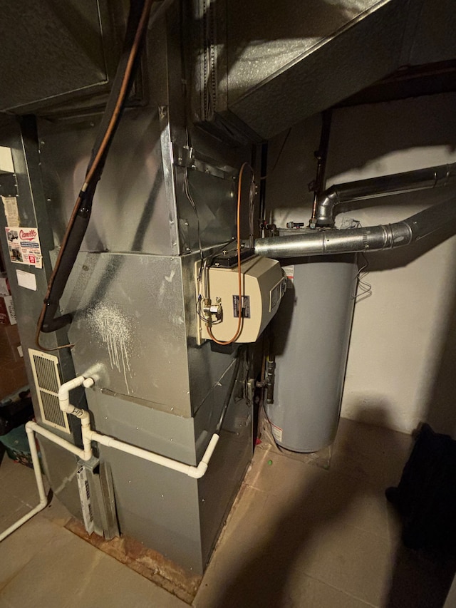 utility room with water heater