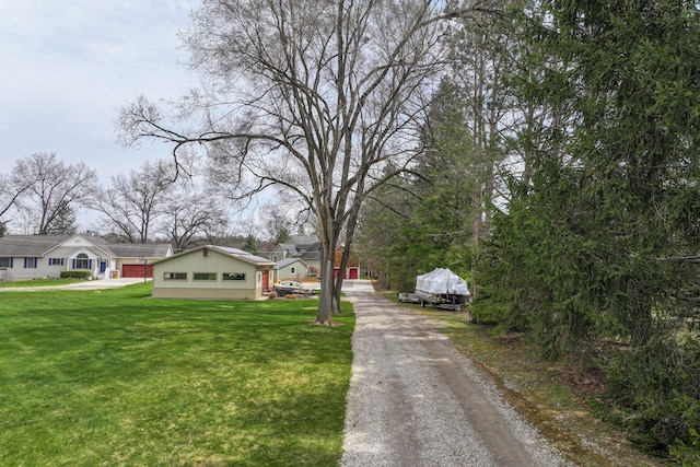 view of street featuring gravel driveway