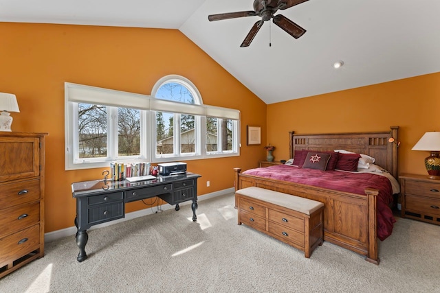bedroom featuring baseboards, lofted ceiling, a ceiling fan, and light colored carpet
