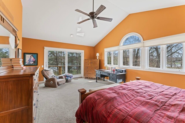 bedroom with high vaulted ceiling and carpet
