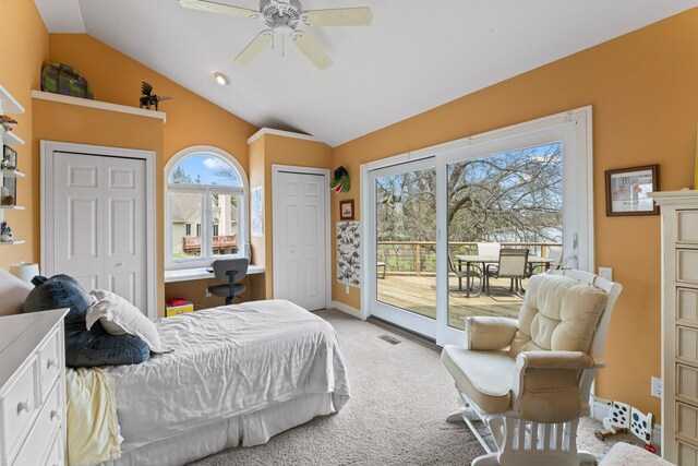 bedroom featuring lofted ceiling, multiple closets, baseboards, light colored carpet, and access to outside