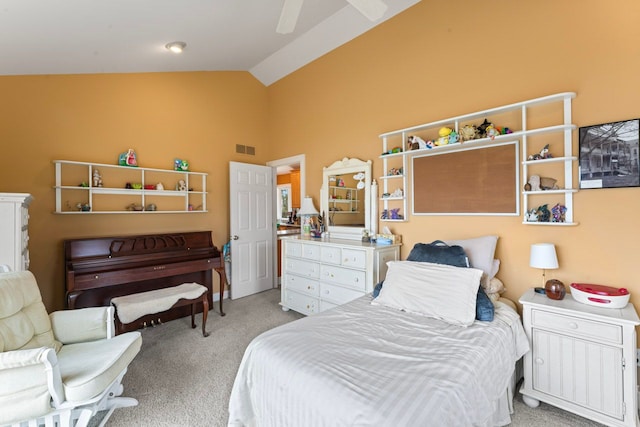 bedroom with light carpet, a ceiling fan, visible vents, and high vaulted ceiling