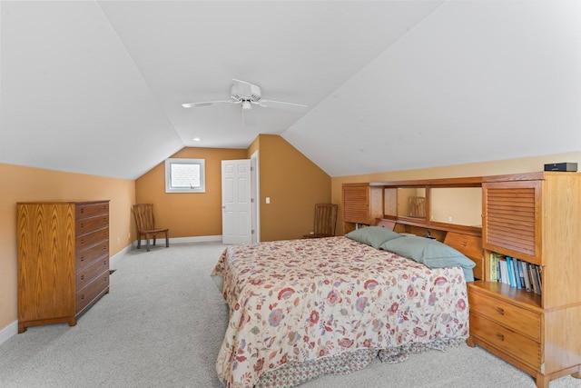 bedroom with vaulted ceiling, carpet floors, a ceiling fan, and baseboards