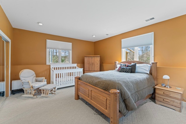 bedroom with recessed lighting, carpet floors, and visible vents