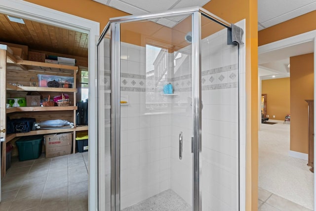 full bathroom featuring a healthy amount of sunlight and a shower stall