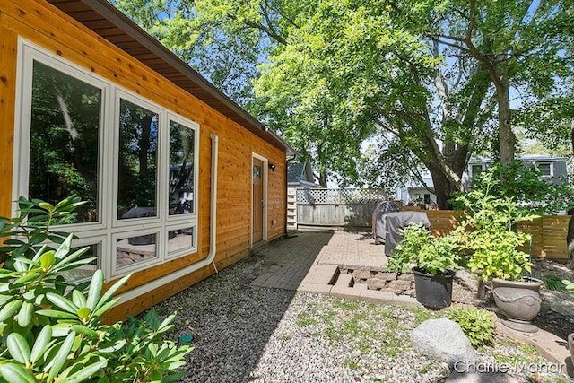 view of property exterior with fence