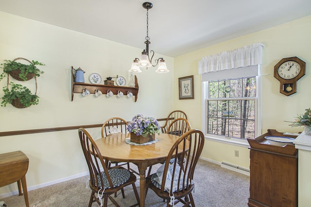 3669 Brentwood St, Norton Shores, MI 49441 - dining room featuring a baseboard heating unit, baseboards, an inviting chandelier, and carpet