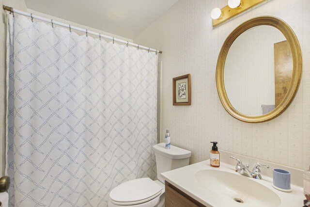 3669 Brentwood St, Norton Shores, MI 49441 - bathroom featuring wallpapered walls, toilet, vanity, and a shower with curtain