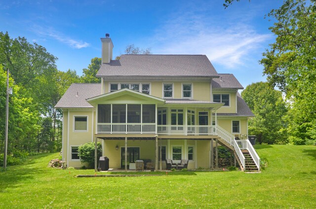 5371 S 4th St, Kalamazoo, MI 49009 - back of property with a sunroom, a chimney, stairway, and a yard