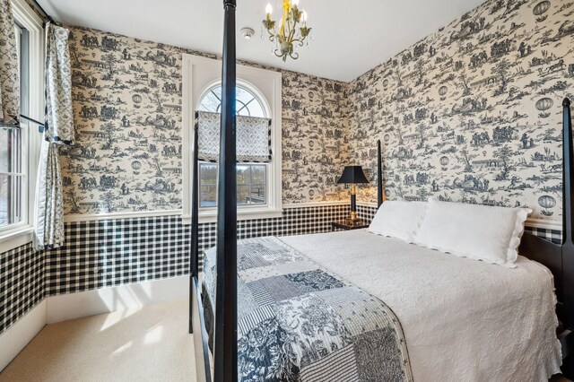 2801 Niles Buchanan Rd, Buchanan, MI 49107 - bedroom with wallpapered walls, wainscoting, and an inviting chandelier