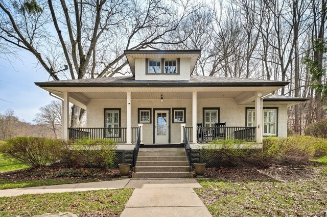 2801 Niles Buchanan Rd, Buchanan, MI 49107 - view of front of home with covered porch and stucco siding