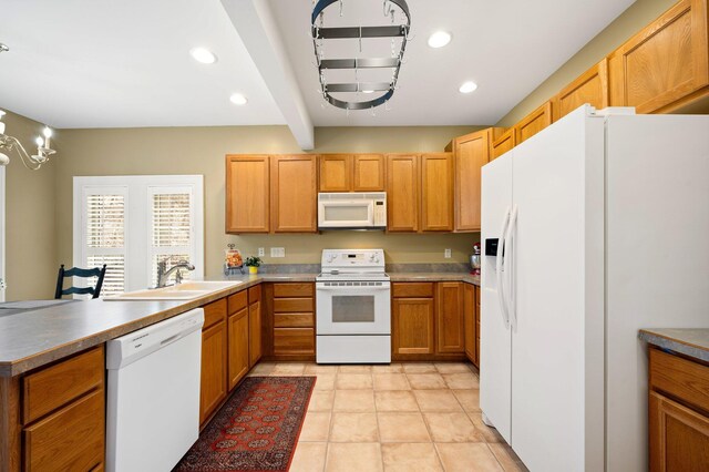 2801 Niles Buchanan Rd, Buchanan, MI 49107 - kitchen with a peninsula, white appliances, a sink, and recessed lighting