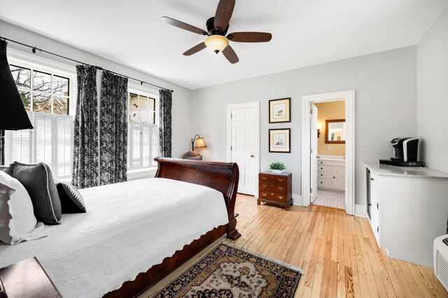 2801 Niles Buchanan Rd, Buchanan, MI 49107 - bedroom with ensuite bath, light wood finished floors, baseboards, and ceiling fan