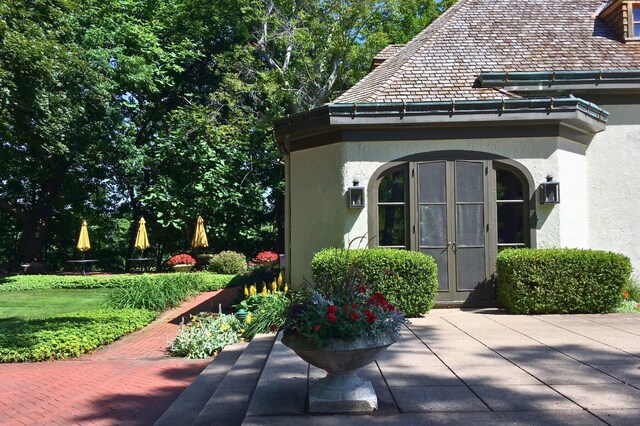 2801 Niles Buchanan Rd, Buchanan, MI 49107 - exterior space with a patio, french doors, and stucco siding