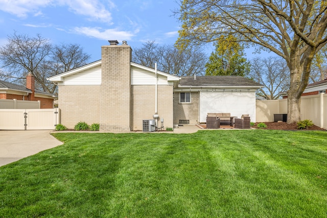 rear view of property with an outdoor hangout area, central AC unit, a fenced backyard, and a gate