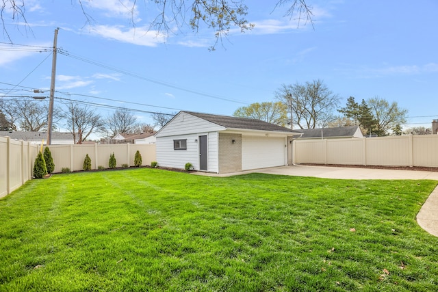 view of yard featuring a patio, a garage, and a fenced backyard