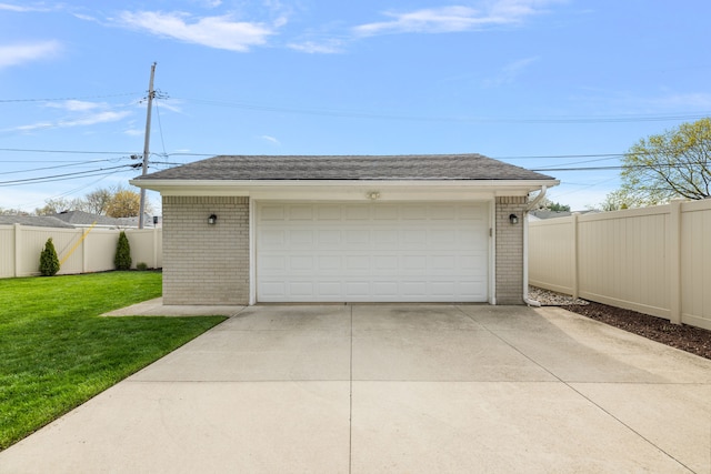 detached garage featuring fence