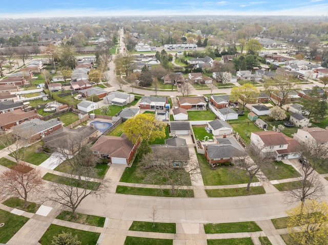 birds eye view of property with a residential view