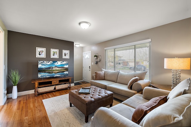 living room with light wood-style floors and baseboards