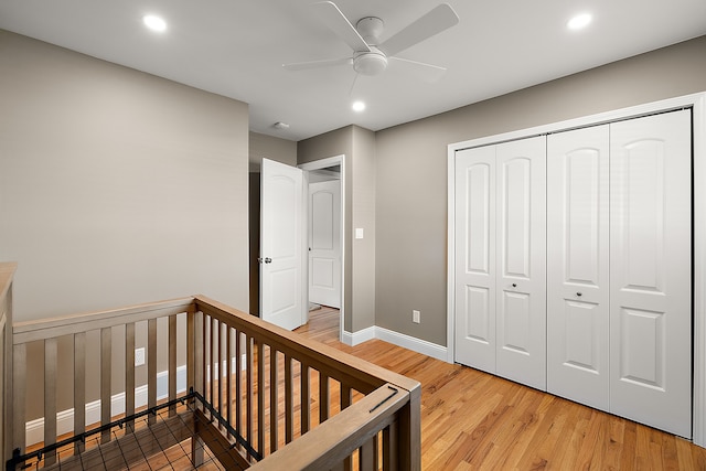 bedroom with recessed lighting, a closet, a ceiling fan, baseboards, and wood finished floors