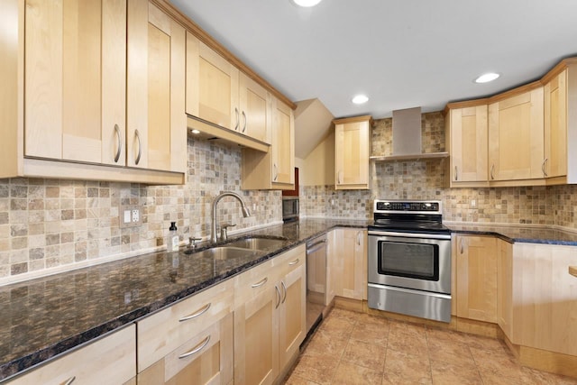 16191 Seymour Rd, Argentine, MI 48451 - kitchen with stainless steel appliances, wall chimney range hood, a sink, light brown cabinets, and dark stone countertops