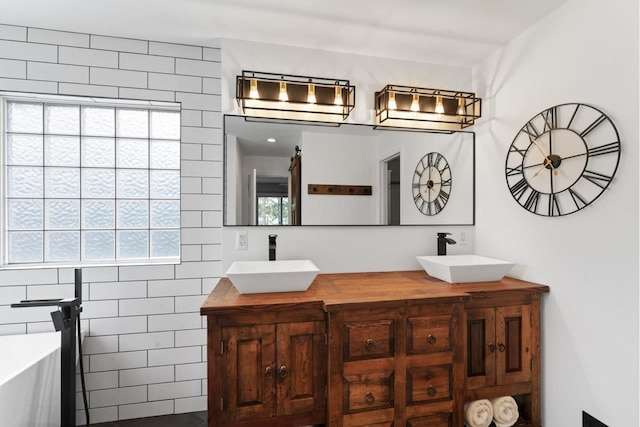 16191 Seymour Rd, Argentine, MI 48451 - bathroom with double vanity and a freestanding bath