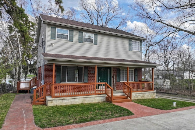 16191 Seymour Rd, Argentine, MI 48451 - view of front facade featuring covered porch, brick siding, and a front lawn