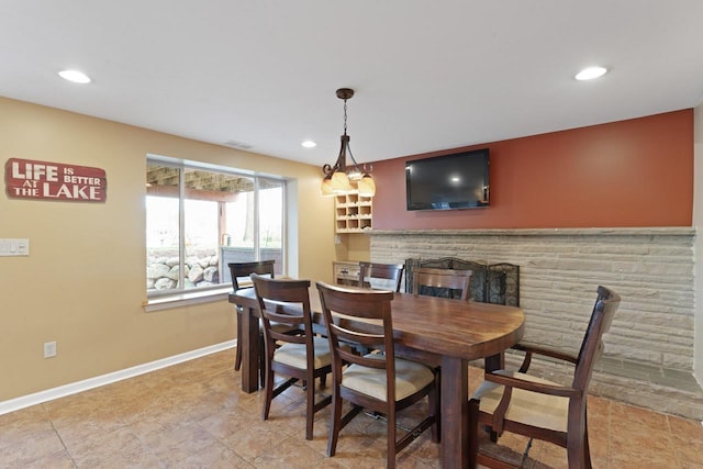16191 Seymour Rd, Argentine, MI 48451 - dining space featuring recessed lighting, baseboards, and a stone fireplace