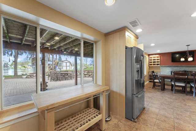 16191 Seymour Rd, Argentine, MI 48451 - kitchen with stainless steel fridge with ice dispenser, light brown cabinets, recessed lighting, and light tile patterned floors