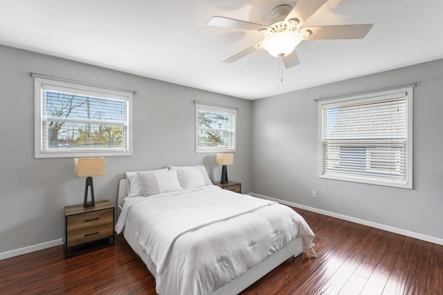 16191 Seymour Rd, Argentine, MI 48451 - bedroom with baseboards, wood finished floors, and a ceiling fan