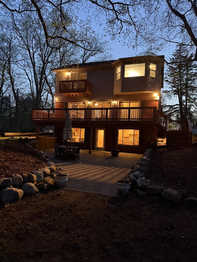16191 Seymour Rd, Argentine, MI 48451 - back of house with a patio area, a balcony, a wooden deck, stairs, and outdoor dining space