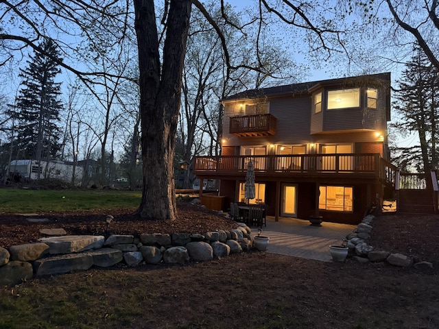 16191 Seymour Rd, Argentine, MI 48451 - back of property featuring a balcony, a patio area, a deck, and stairway