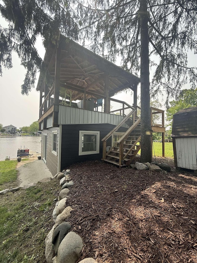 16191 Seymour Rd, Argentine, MI 48451 - view of yard featuring stairway and a deck with water view