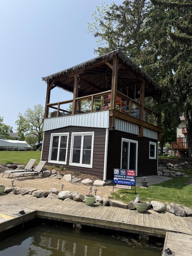 16191 Seymour Rd, Argentine, MI 48451 - back of house with a balcony, a water view, and a yard