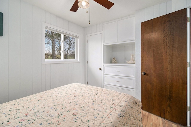 bedroom featuring a ceiling fan and light wood-type flooring